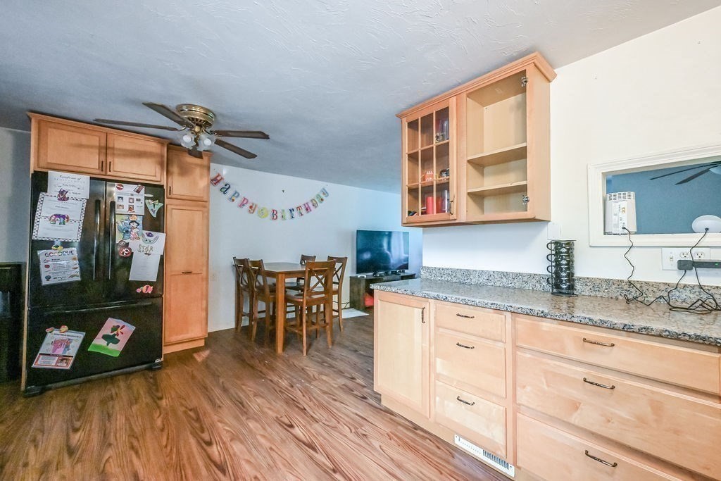 9 Lawrence Road Plymouth, MA 02360 - Photo 7 of 30 a kitchen with granite countertop a cabinets a sink a dining table and chairs