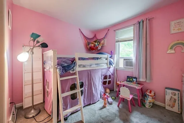 a view of livingroom with furniture and a window