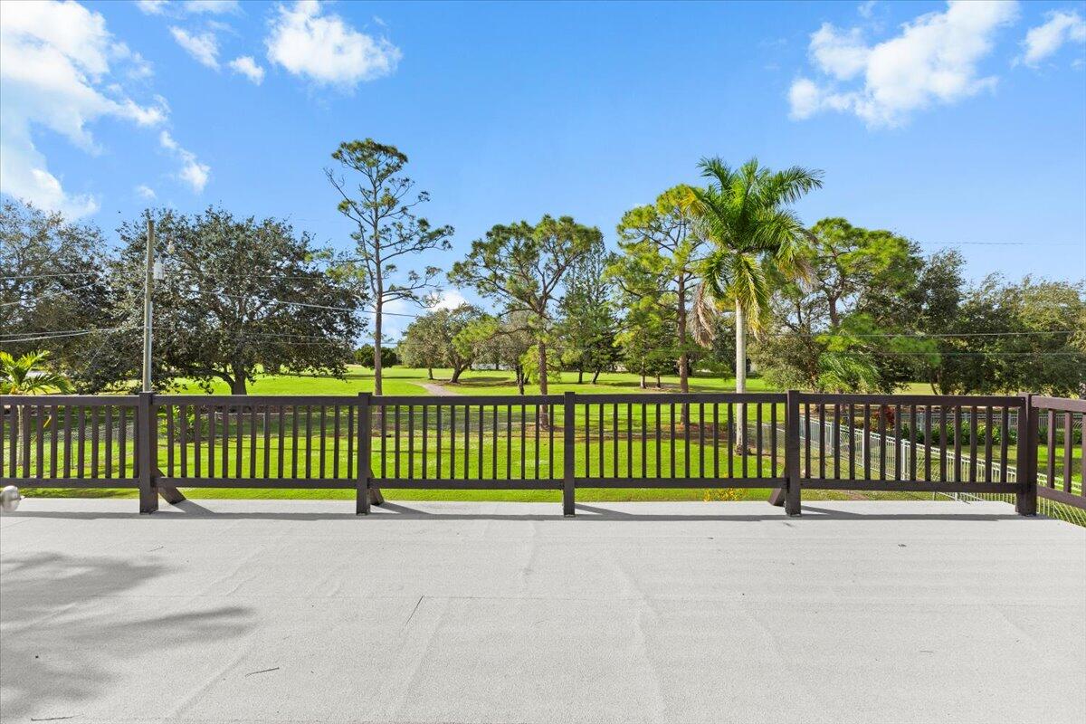 3179 Hoy Lake Road Wellington, FL 33467 - Photo 20 of 43 a view of street with a small yard