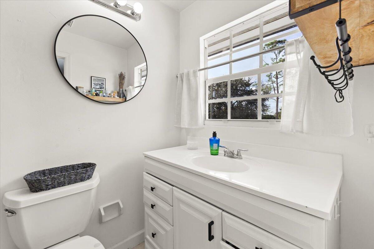 3179 Hoy Lake Road Wellington, FL 33467 - Photo 28 of 43 a bathroom with a sink and a mirror