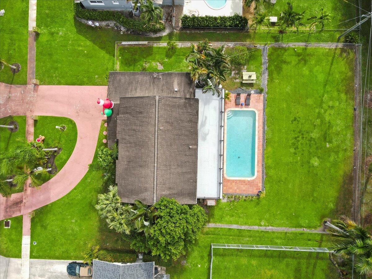 3179 Hoy Lake Road Wellington, FL 33467 - Photo 38 of 43 an aerial view of a house with a garden and yard