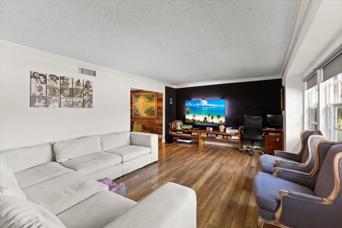 3179 Hoy Lake Road Wellington, FL 33467 - Photo 5 of 43 a living room with furniture and a flat screen tv
