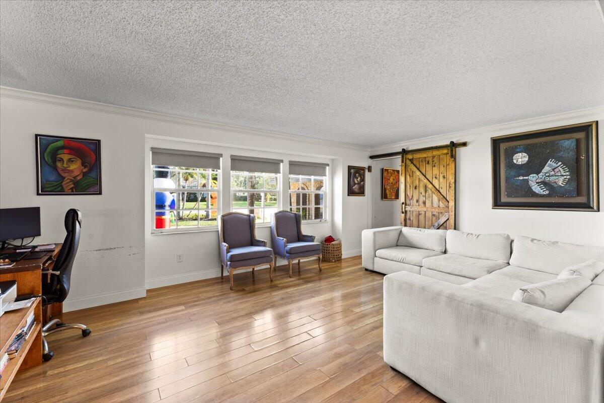 3179 Hoy Lake Road Wellington, FL 33467 - Photo 6 of 43 a living room with furniture and a window