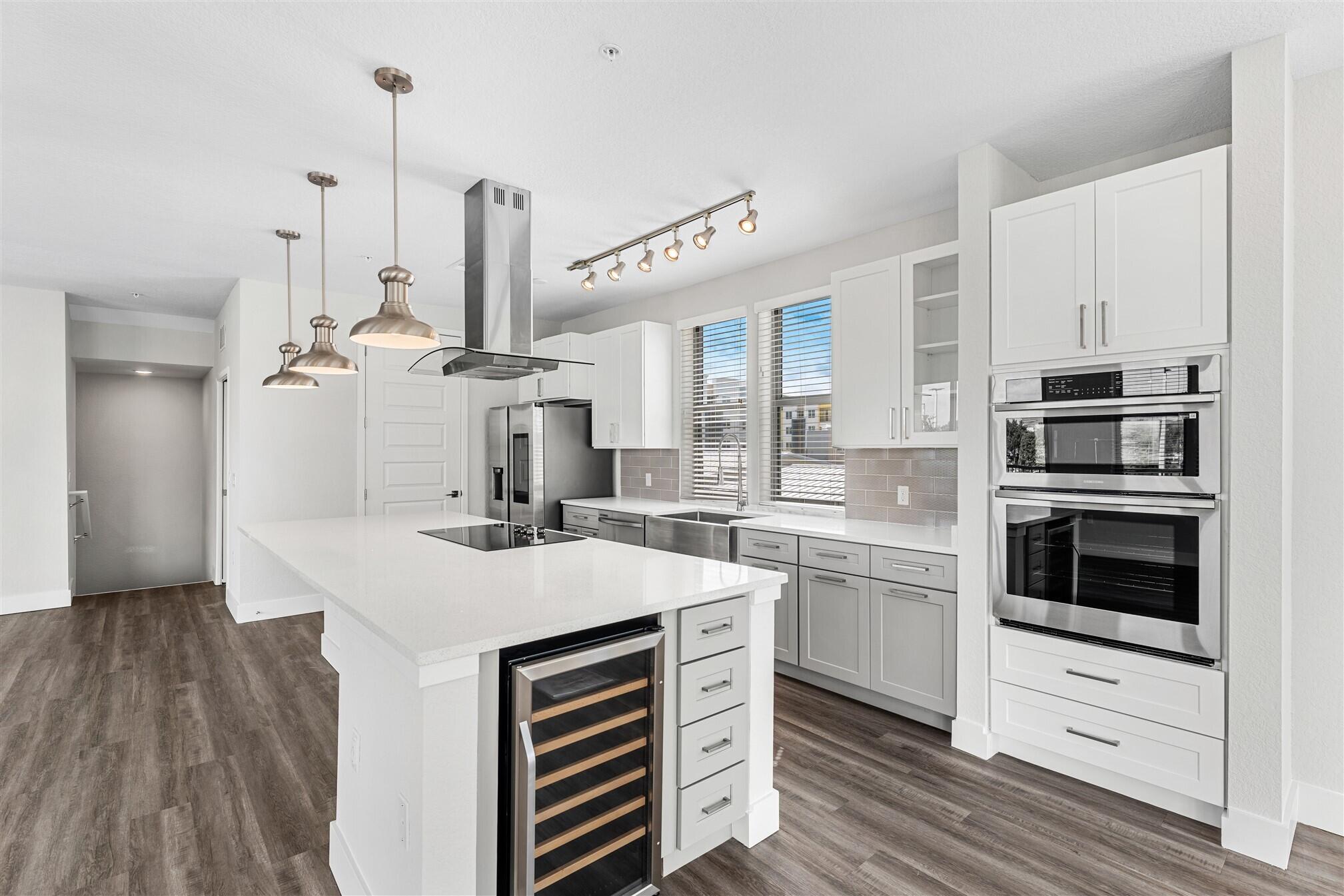 8663 Ivanhoe Drive Melbourne, FL 32940 - Photo 16 of 36 a kitchen with a sink and white cabinets