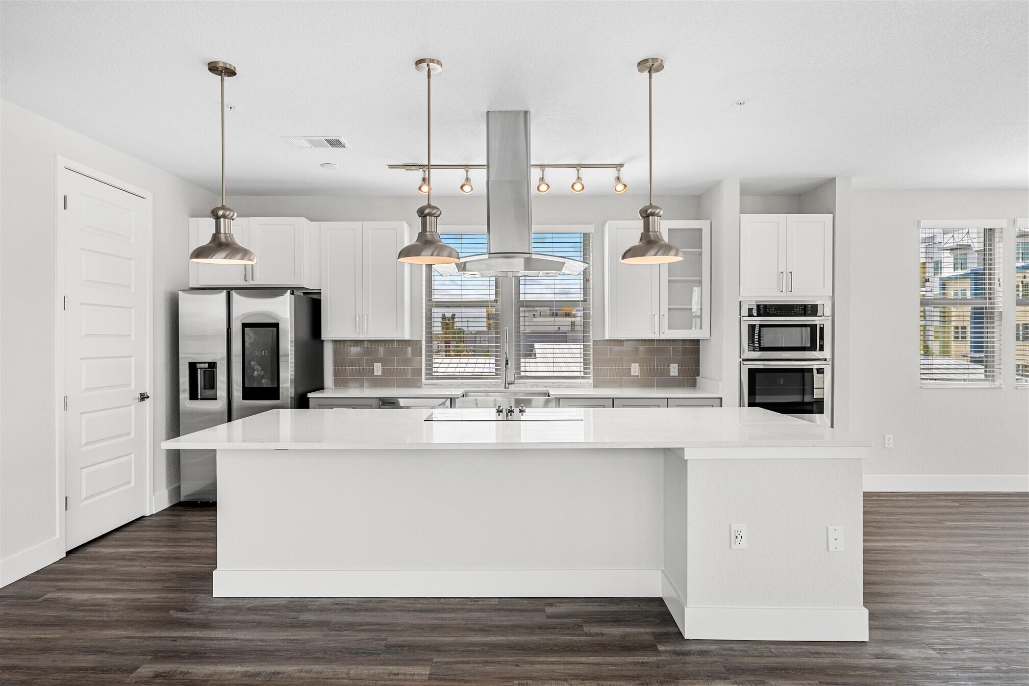 8663 Ivanhoe Drive Melbourne, FL 32940 - Photo 17 of 36 a view of kitchen with stainless steel appliances granite countertop cabinets and window
