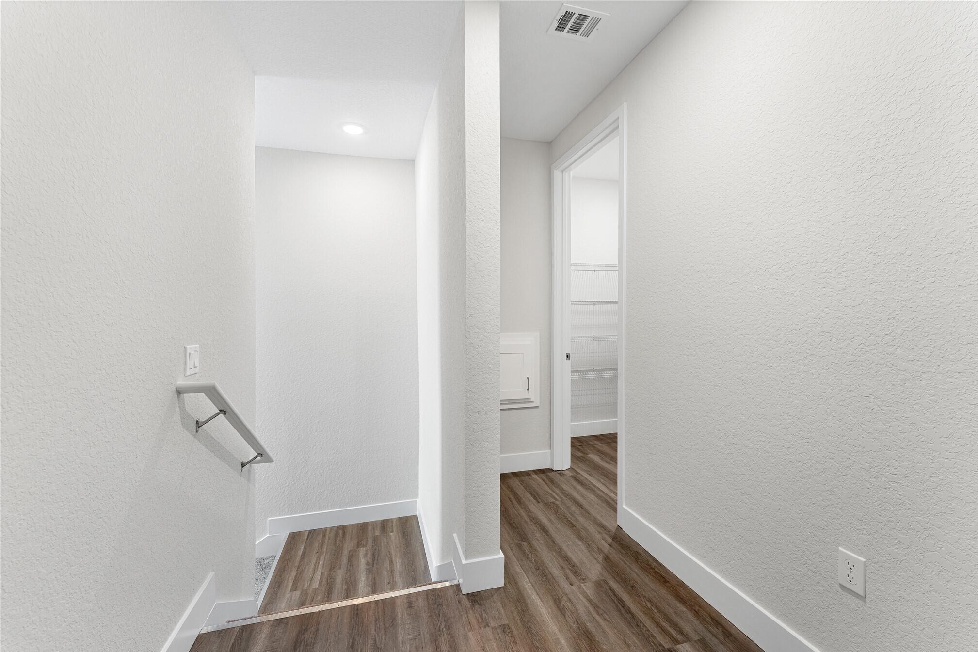 8663 Ivanhoe Drive Melbourne, FL 32940 - Photo 26 of 36 a view of room with wooden floor