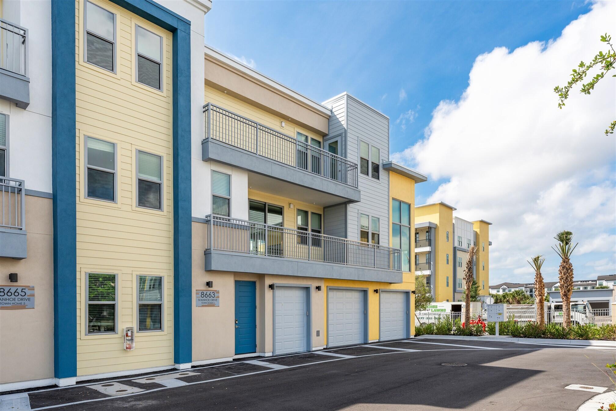 8663 Ivanhoe Drive Melbourne, FL 32940 - Photo 3 of 36 a view of a building with a street