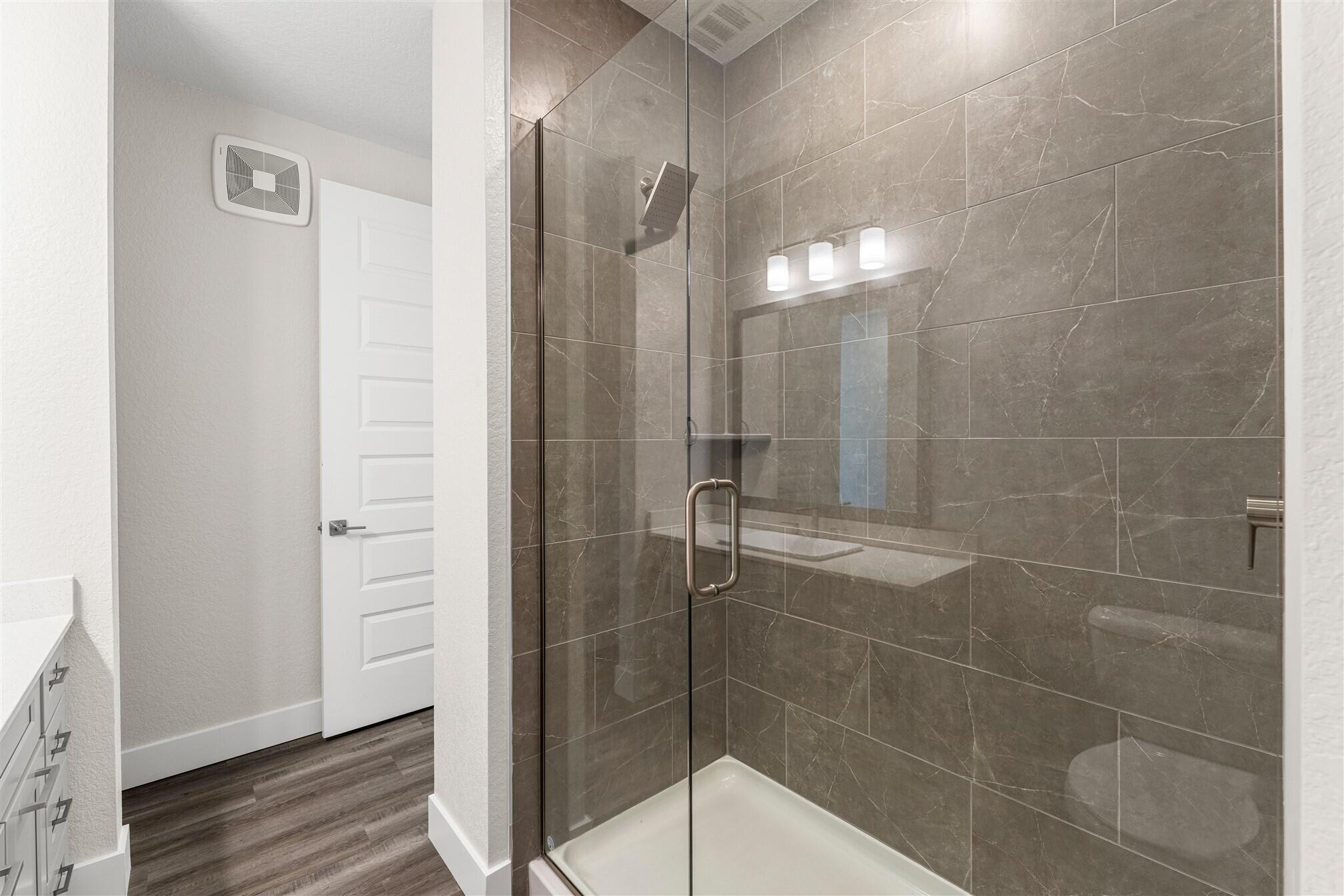 8663 Ivanhoe Drive Melbourne, FL 32940 - Photo 10 of 36 a bathroom with a shower