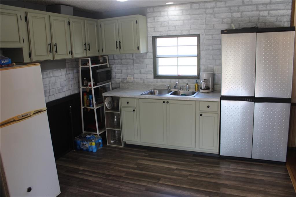 245 Old Brick Road Hilliards, PA 16040 - Photo 2 of 46 a room with wooden floor and windows