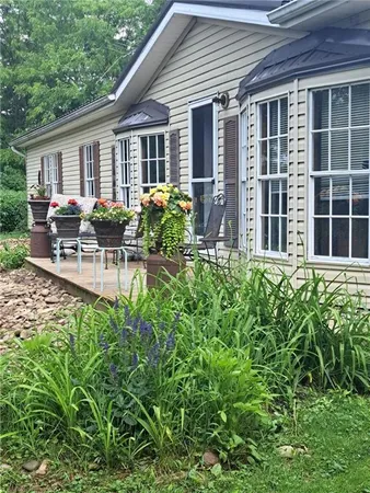 a view of backyard with a patio and outdoor seating