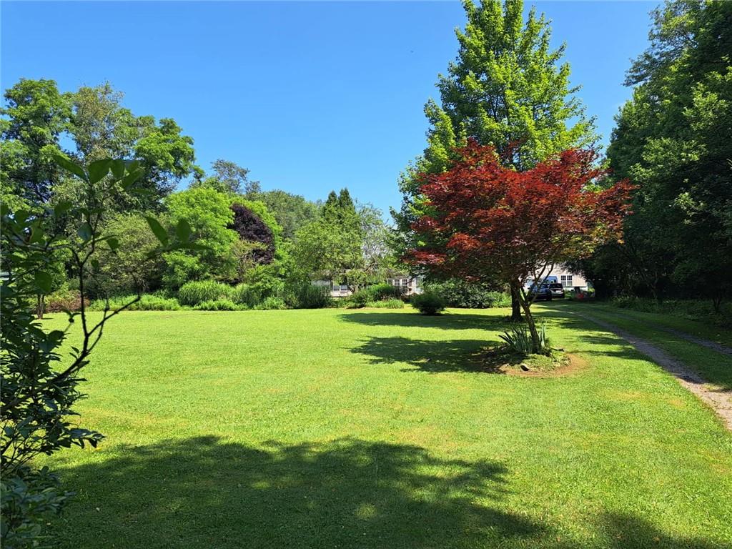245 Old Brick Road Hilliards, PA 16040 - Photo 24 of 46 a view of a golf course with a lake