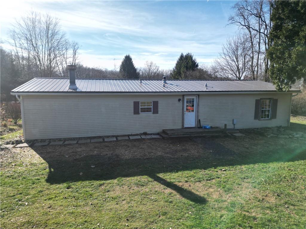 245 Old Brick Road Hilliards, PA 16040 - Photo 29 of 46 a view of a house with a yard