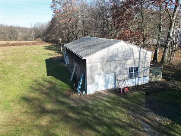 a view of a tiny house with backyard
