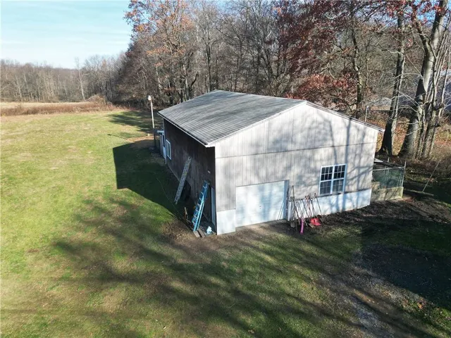 a view of a tiny house with backyard