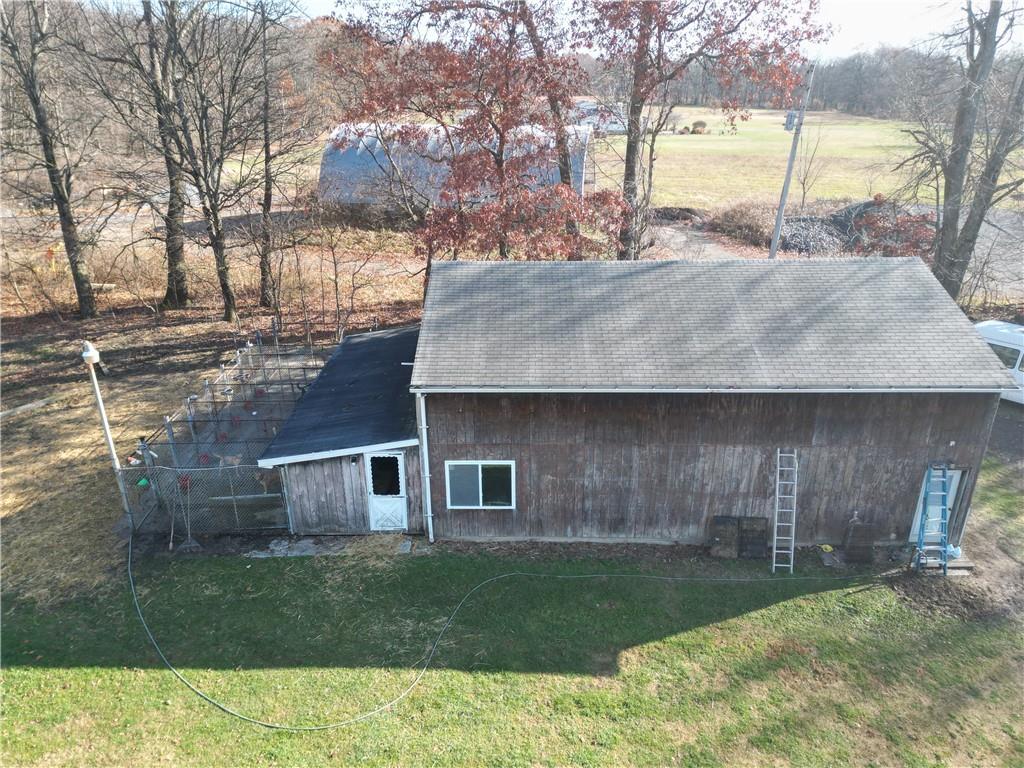 245 Old Brick Road Hilliards, PA 16040 - Photo 36 of 46 a backyard of a house with seating space