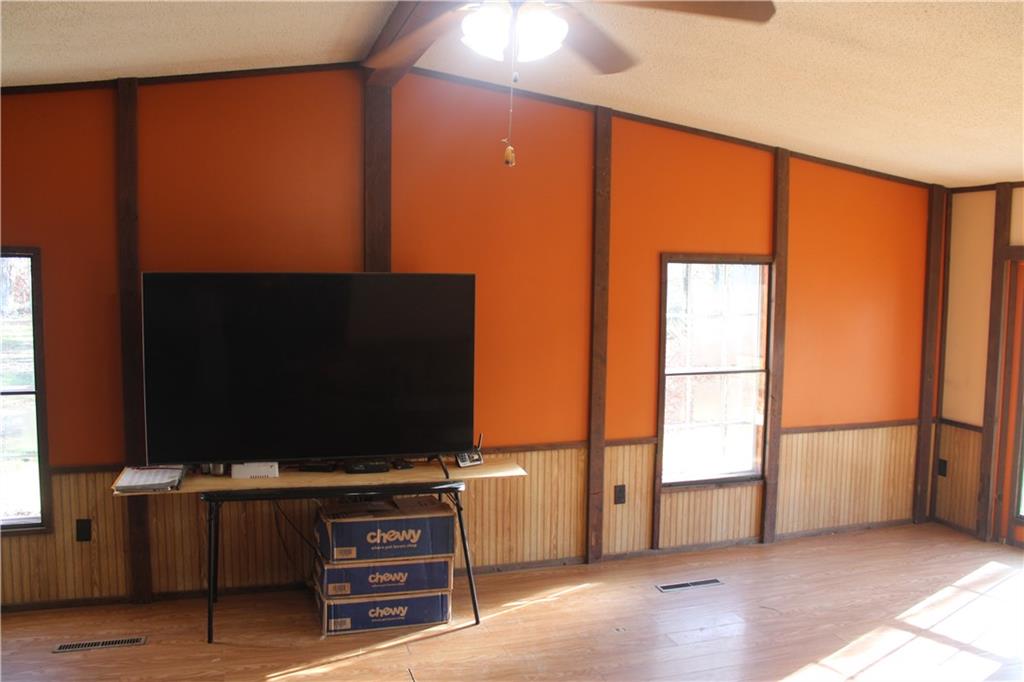 245 Old Brick Road Hilliards, PA 16040 - Photo 6 of 46 a living room with furniture and a flat screen tv