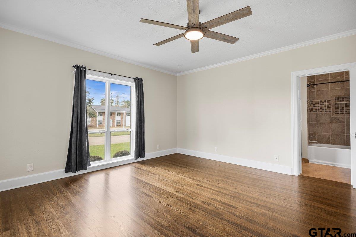 1609 Old Nacogdoches Road Henderson, TX 75654 - Photo 17 of 48 wooden floor in an empty room with a window