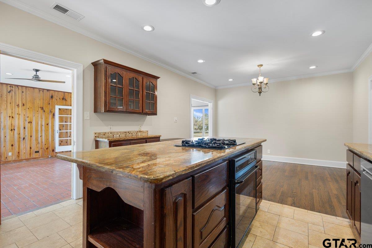 1609 Old Nacogdoches Road Henderson, TX 75654 - Photo 2 of 48 a kitchen with a stove and a table