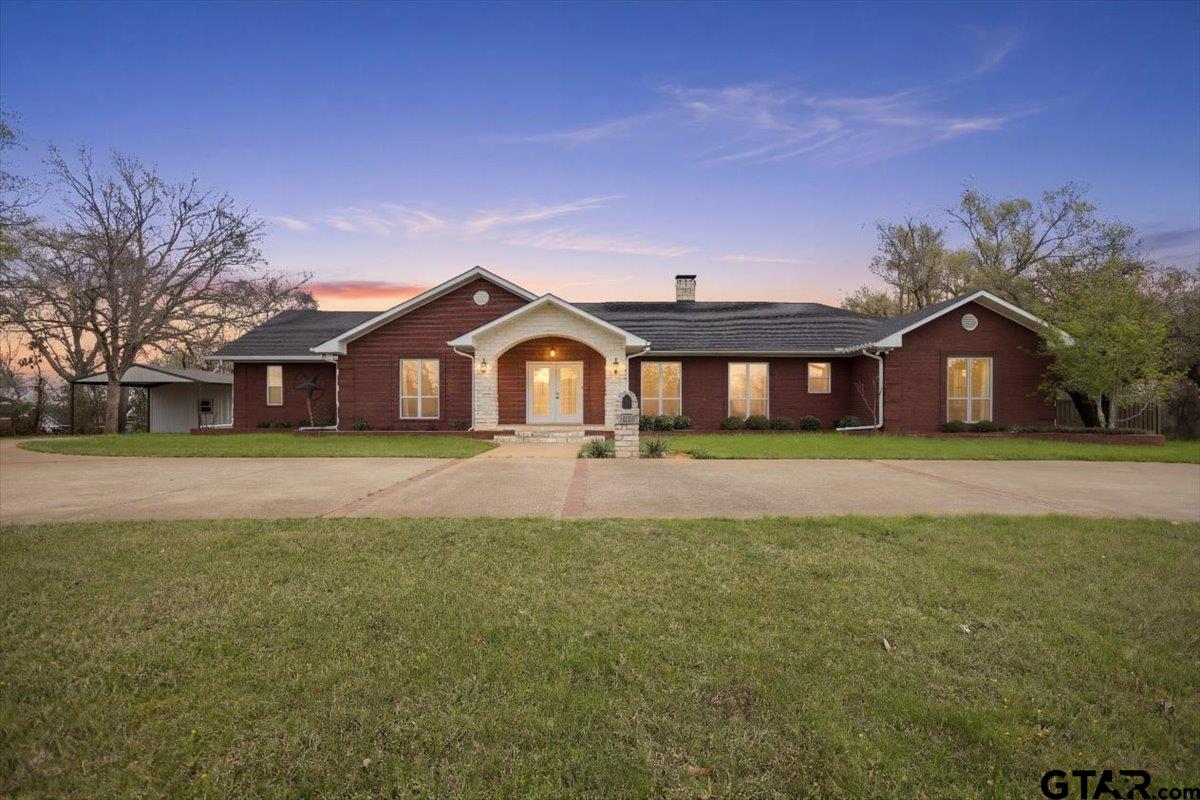 1609 Old Nacogdoches Road Henderson, TX 75654 - Photo 3 of 48 a front view of house with yard and green space
