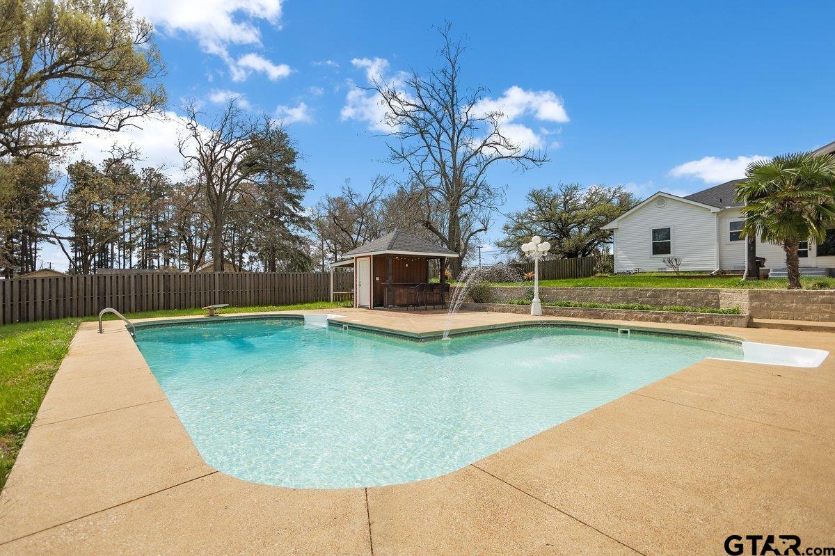 1609 Old Nacogdoches Road Henderson, TX 75654 - Photo 33 of 48 a view of a swimming pool with a yard