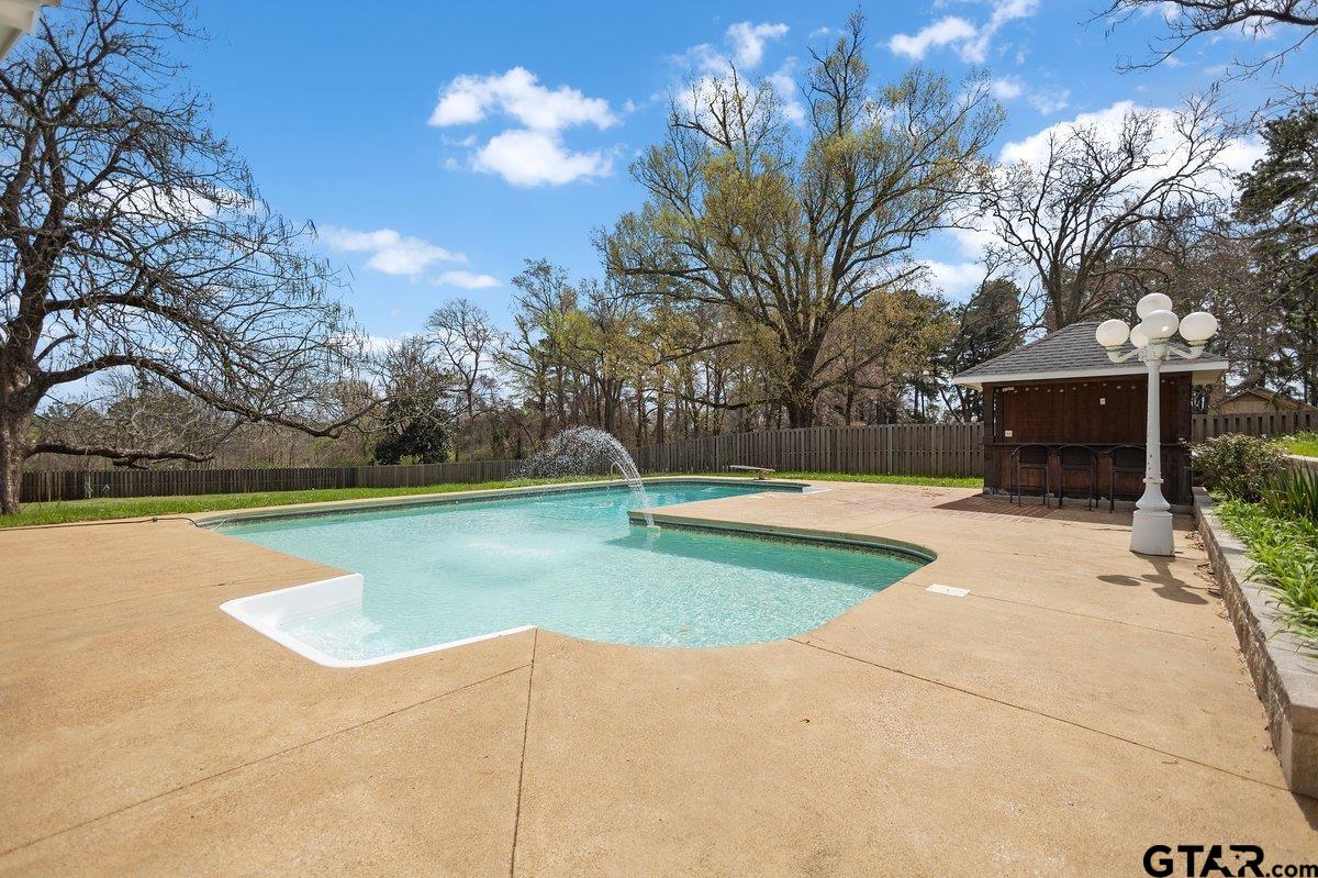 1609 Old Nacogdoches Road Henderson, TX 75654 - Photo 34 of 48 a view of a swimming pool with a yard