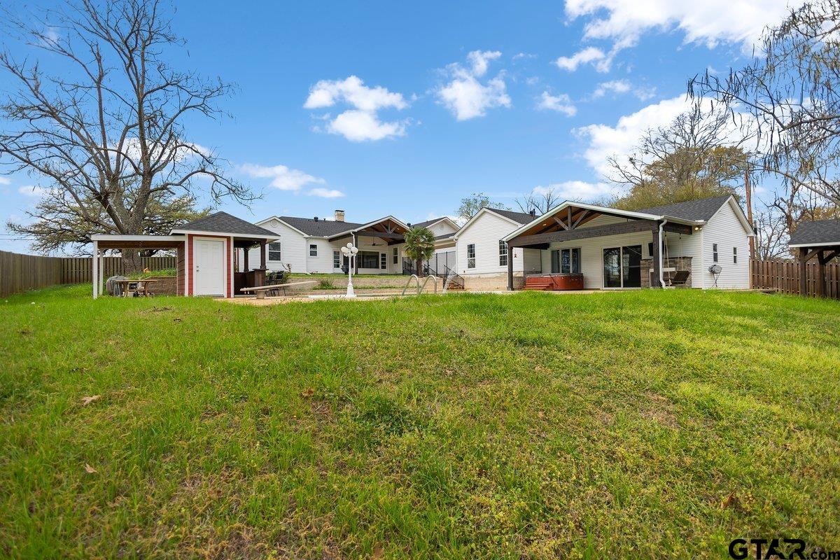 1609 Old Nacogdoches Road Henderson, TX 75654 - Photo 37 of 48 a view of a house with a yard