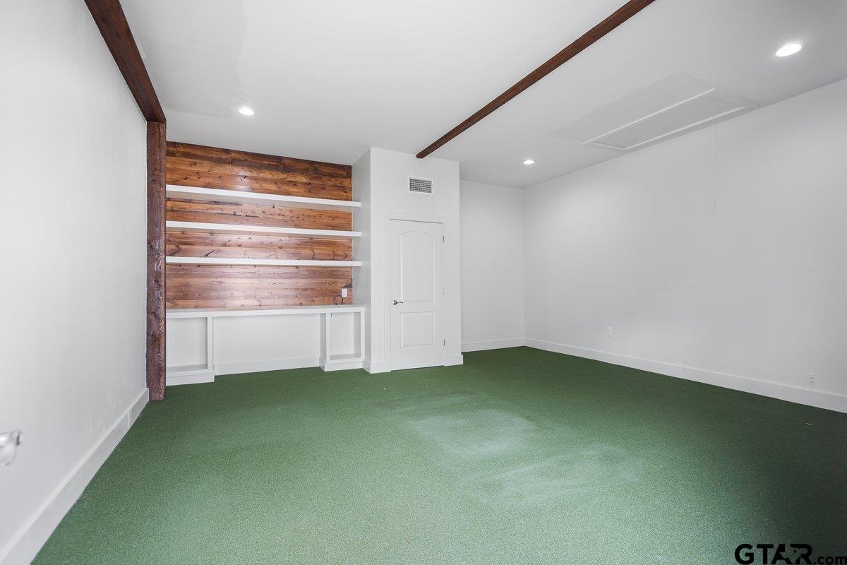 1609 Old Nacogdoches Road Henderson, TX 75654 - Photo 39 of 48 a view of room with a ceiling fan and bathroom
