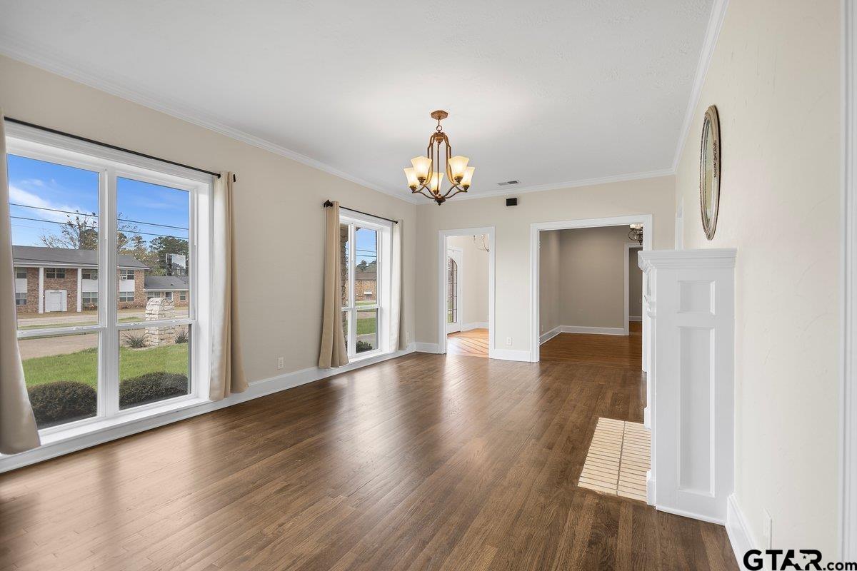 1609 Old Nacogdoches Road Henderson, TX 75654 - Photo 8 of 48 a view of an entryway with wooden floor and a window