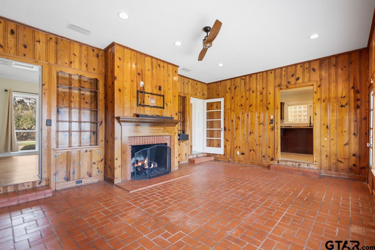 1609 Old Nacogdoches Road Henderson, TX 75654 - Photo 10 of 48 a view of an empty room with a fireplace and a window