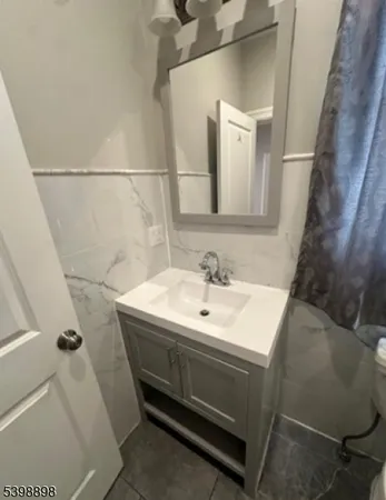 a bathroom with a sink and mirror