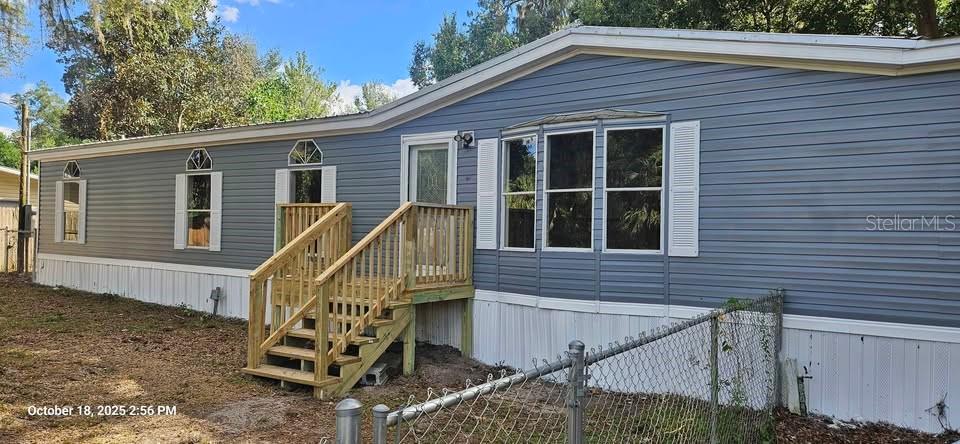 28492 Sentinel Street Nobleton, FL 34661 - Photo 1 of 23 a view of wooden house with a small yard