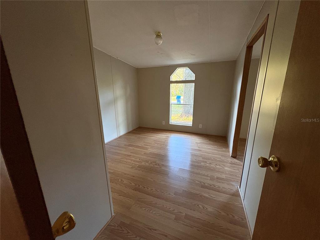 28492 Sentinel Street Nobleton, FL 34661 - Photo 18 of 23 a view of a room with window wooden floor and window