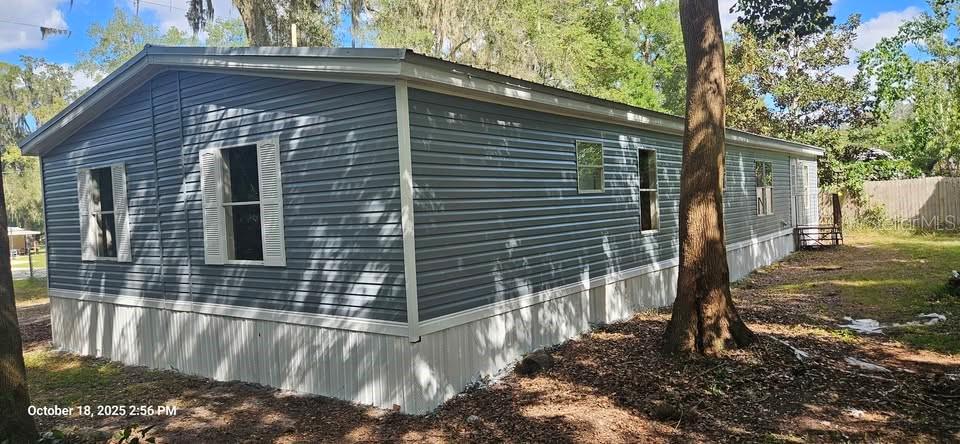 28492 Sentinel Street Nobleton, FL 34661 - Photo 2 of 23 a view of a house with a yard