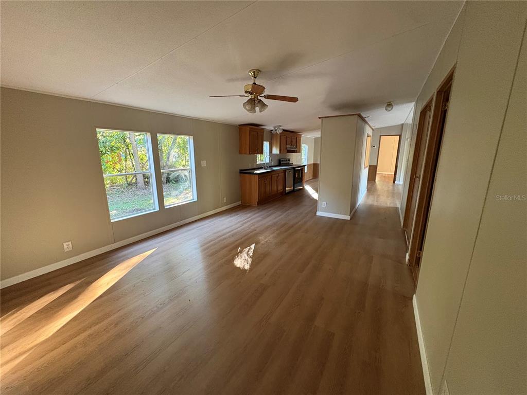 28492 Sentinel Street Nobleton, FL 34661 - Photo 10 of 23 wooden floor in an empty room with a window