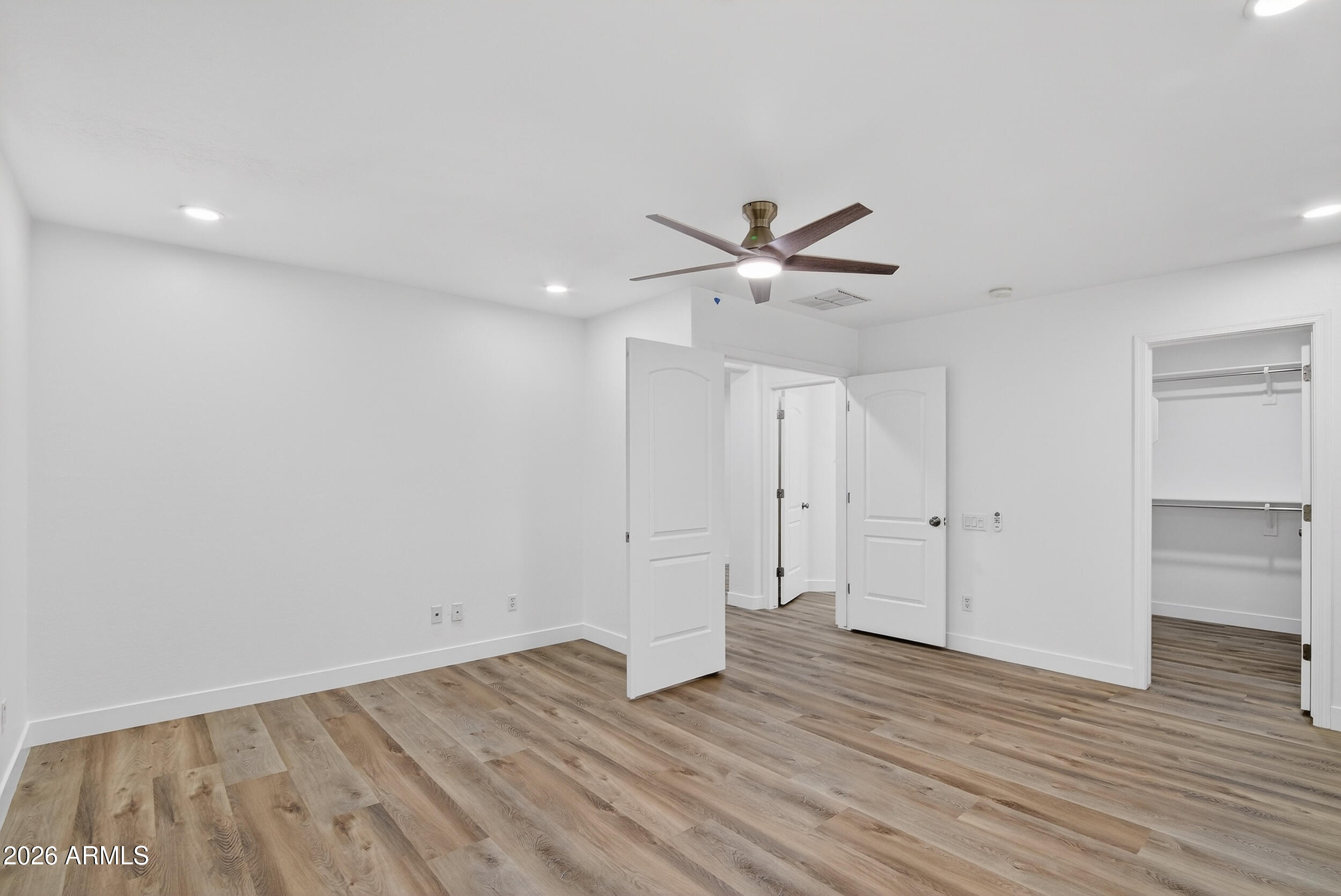 43620 West Cowpath Road Maricopa, AZ 85138 - Photo 10 of 60 wooden floor in an empty room with a window