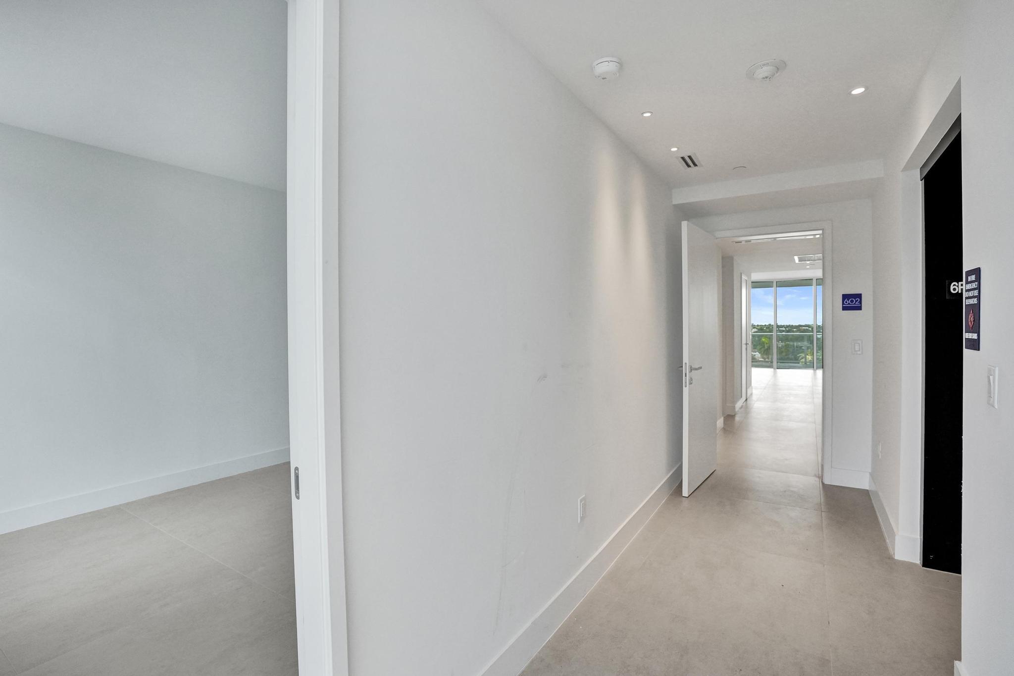 407 North Riverside Drive, Unit 602 Pompano Beach, FL 33062 - Photo 34 of 83 a view of a hallway with wooden floor