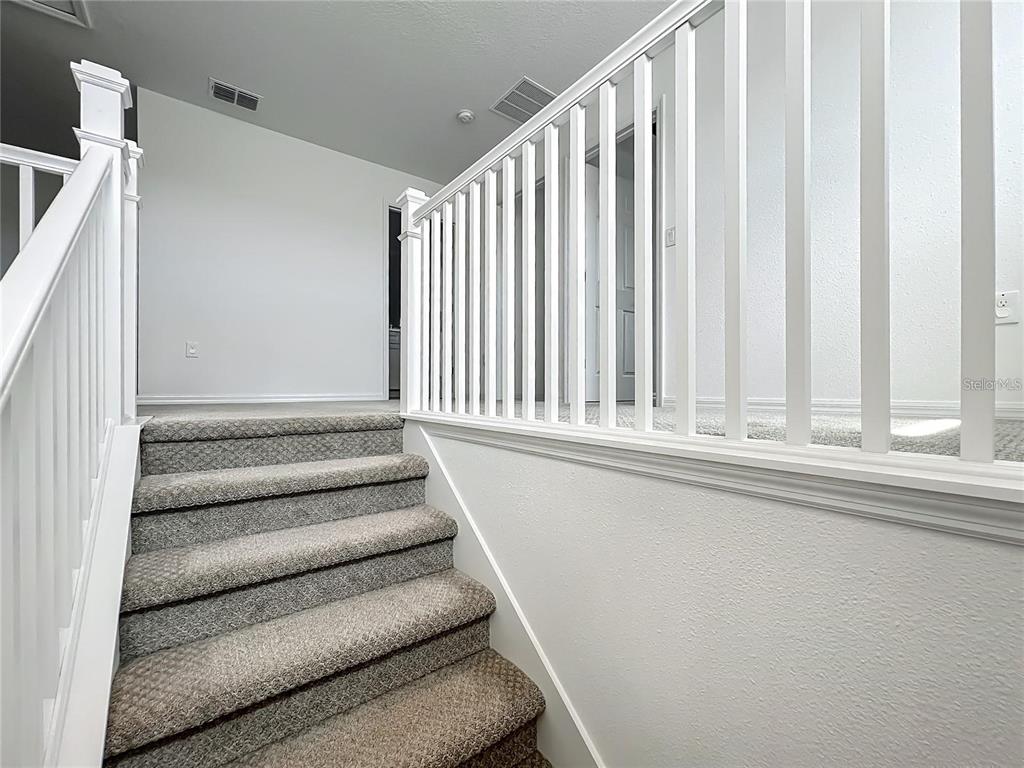 7483 Southwest 64th St Road Ocala, FL 34474 - Photo 29 of 74 a view of staircase with white walls and a window