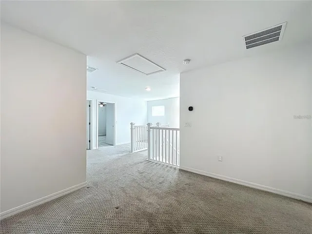 a kitchen with sink cabinets and wooden floor