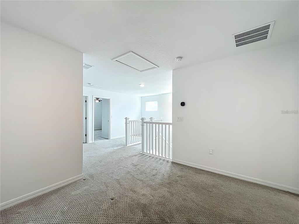 7483 Southwest 64th St Road Ocala, FL 34474 - Photo 33 of 74 a view of a room with a hallway