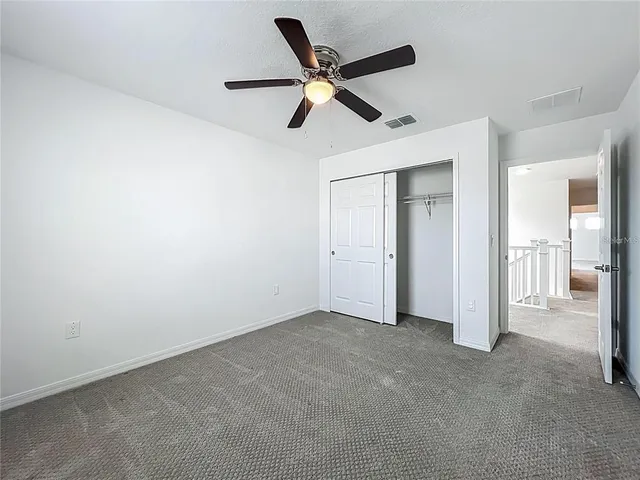 a view of an empty room and a window