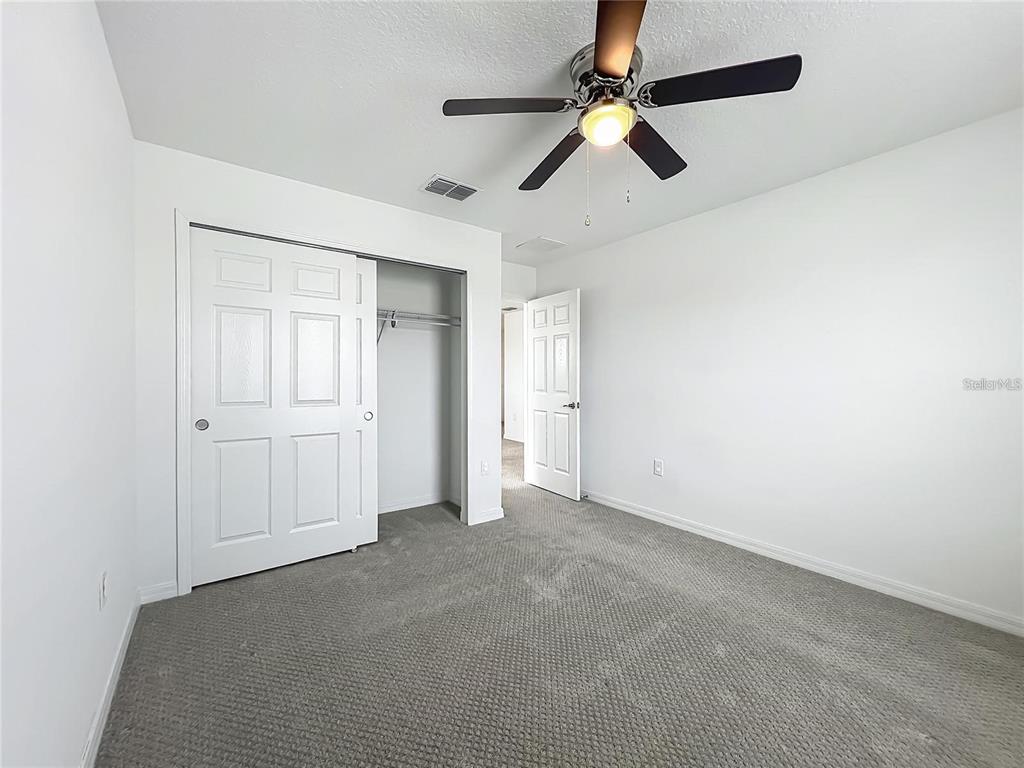 7483 Southwest 64th St Road Ocala, FL 34474 - Photo 38 of 74 an empty room with fan