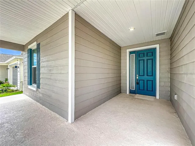 an empty room with wooden floor