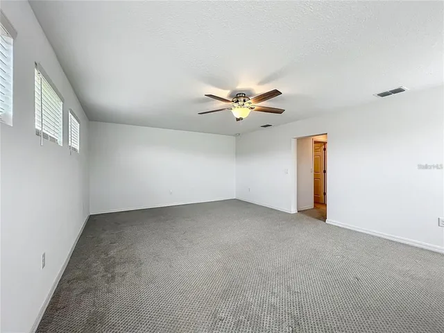 a front view of a house with a garden and yard