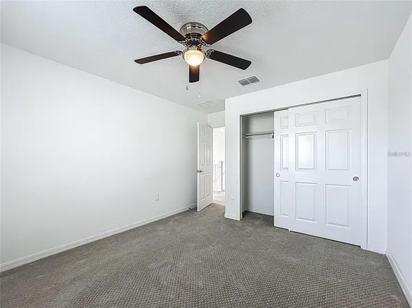 an aerial view of a house with garden space and street view
