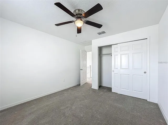 an aerial view of a house with garden space and street view