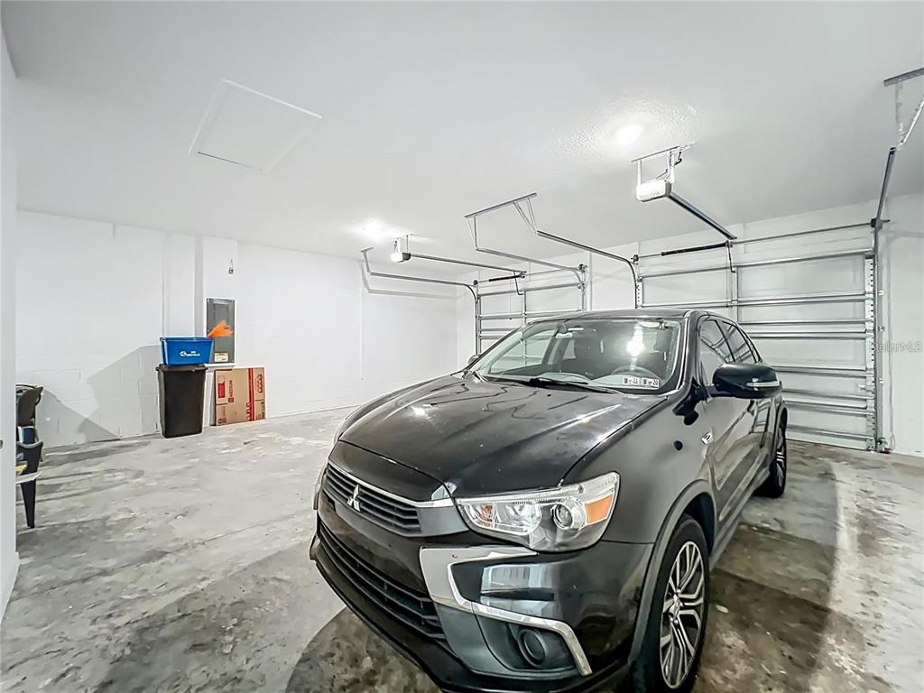 7483 Southwest 64th St Road Ocala, FL 34474 - Photo 54 of 74 a car parked in a garage