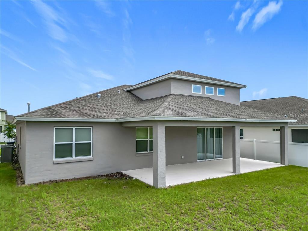 7483 Southwest 64th St Road Ocala, FL 34474 - Photo 59 of 74 a front view of a house with a yard