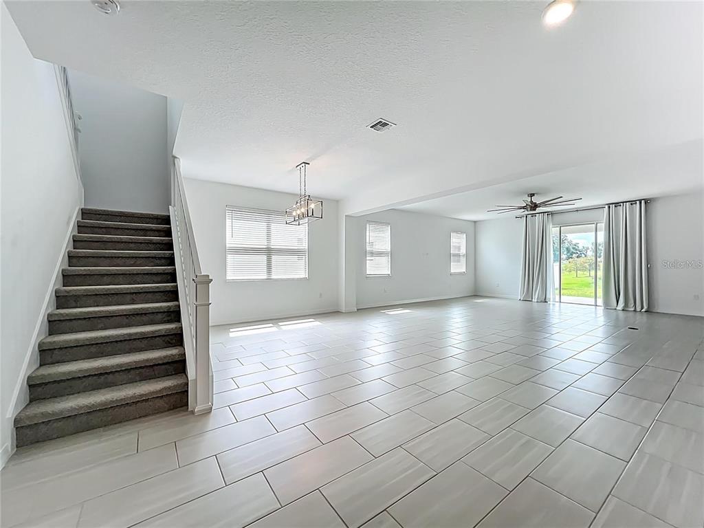 7483 Southwest 64th St Road Ocala, FL 34474 - Photo 8 of 74 an empty room with windows and white walls