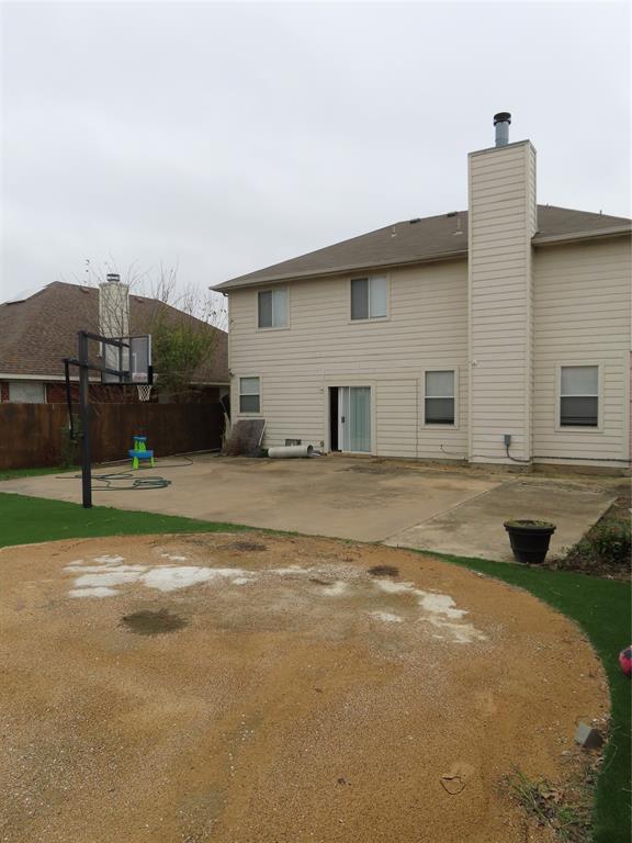 4524 Lodestone Lane Fort Worth, TX 76123 - Photo 9 of 9 Back of property with a chimney and a patio