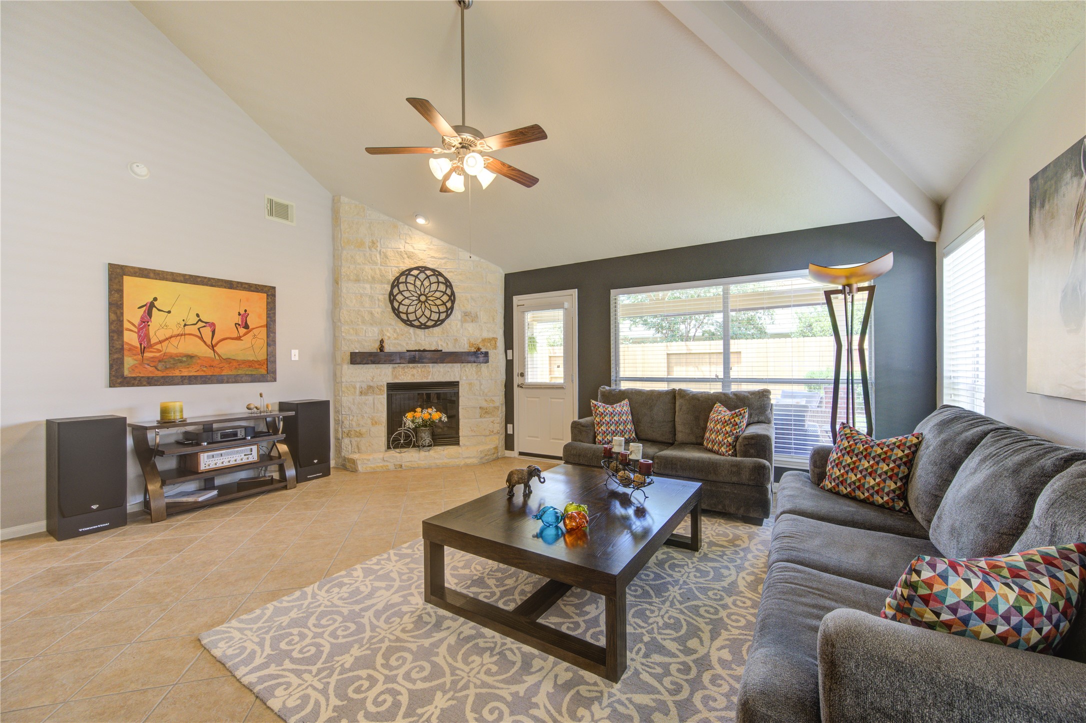 25215 Hazel Ranch Drive Katy, TX 77494 - Photo 14 of 32 a living room with furniture a fireplace and a flat screen tv